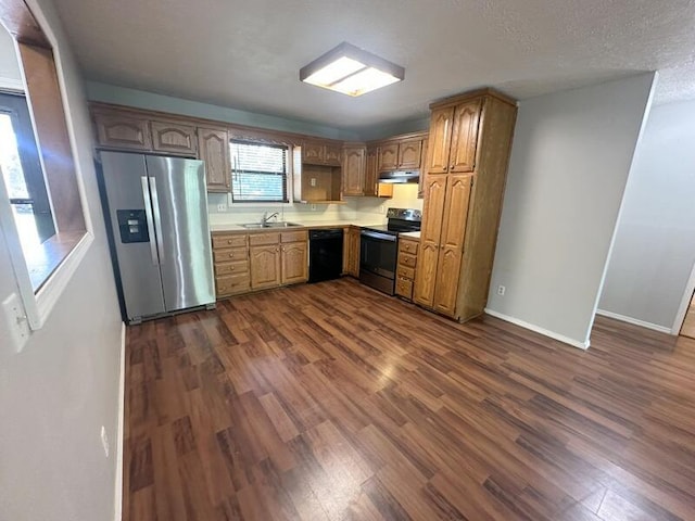 2201 S 18th Ave, Ozark, MO 65721 - kitchen featuring electric range, stainless steel fridge, black dishwasher, under cabinet range hood, and dark wood-style flooring