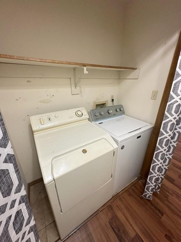 2201 S 18th Ave, Ozark, MO 65721 - washroom featuring washer and clothes dryer and wood finished floors