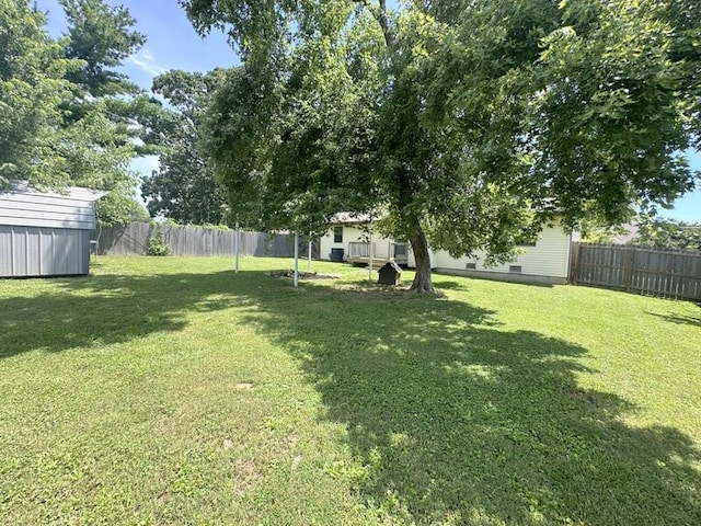 2201 S 18th Ave, Ozark, MO 65721 - fenced backyard featuring a storage unit