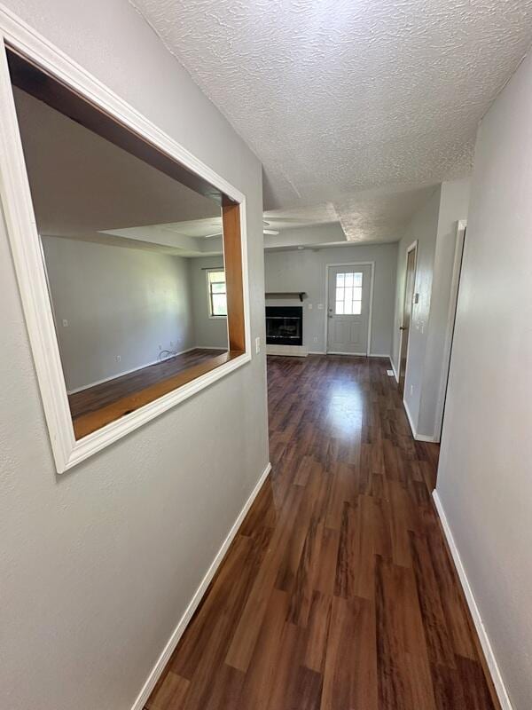 2201 S 18th Ave, Ozark, MO 65721 - corridor featuring wood finished floors and a textured ceiling
