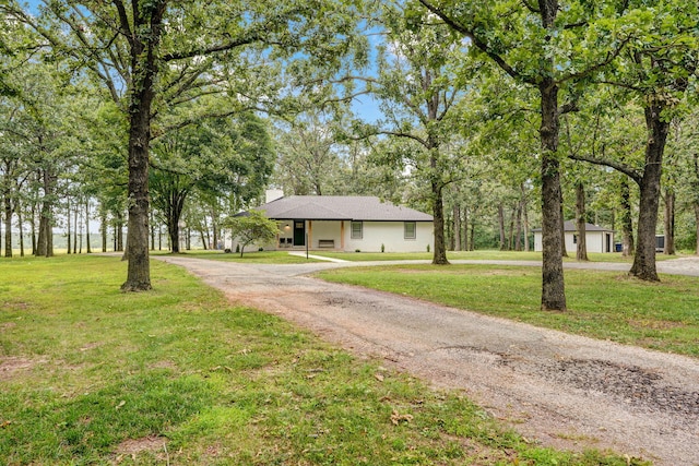 12163 State Highway Tt, Republic, MO 65738 - view of front of house with a front yard, a chimney, and driveway