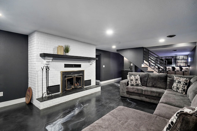 12163 State Highway Tt, Republic, MO 65738 - living area with a fireplace, stairway, and finished concrete floors
