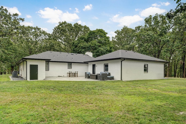 12163 State Highway Tt, Republic, MO 65738 - back of house with a patio, outdoor lounge area, brick siding, and a yard