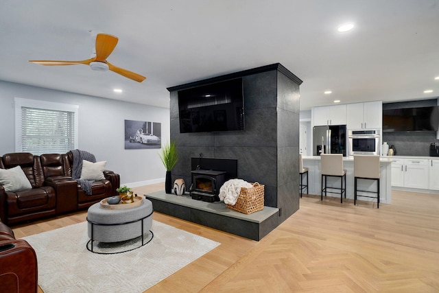 12163 State Highway Tt, Republic, MO 65738 - living room with recessed lighting, a ceiling fan, and a wood stove