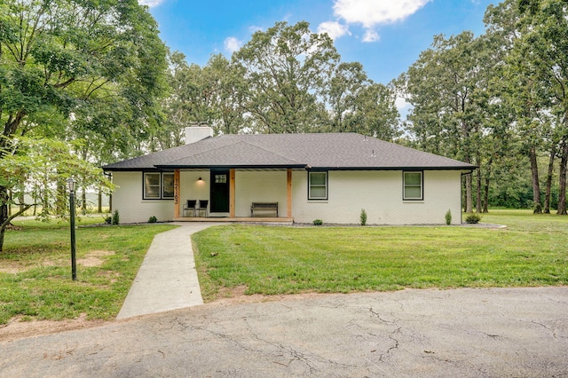 12163 State Highway Tt, Republic, MO 65738 - single story home with a chimney, a front lawn, covered porch, and brick siding