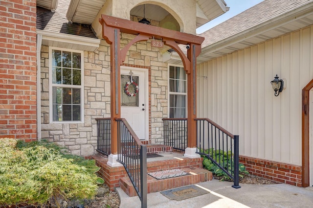 823 Mcvey St, Mount Vernon, MO 65712 - entrance to property featuring stone siding and roof with shingles