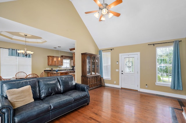 823 Mcvey St, Mount Vernon, MO 65712 - living room featuring a chandelier, wood finished floors, ceiling fan, and high vaulted ceiling