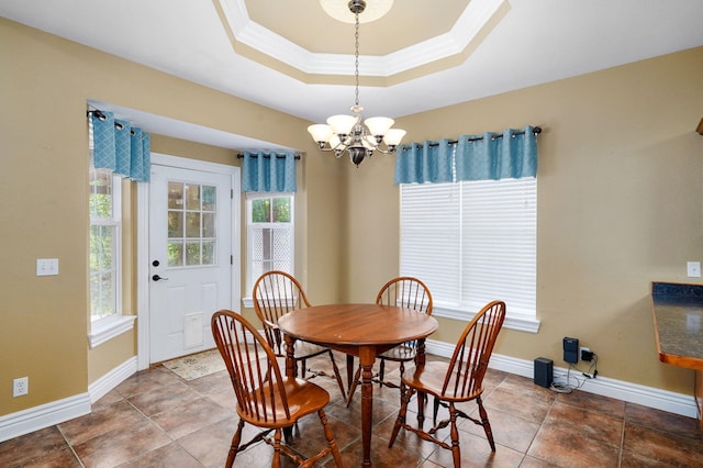 823 Mcvey St, Mount Vernon, MO 65712 - dining space with a chandelier, a raised ceiling, ornamental molding, and tile patterned flooring
