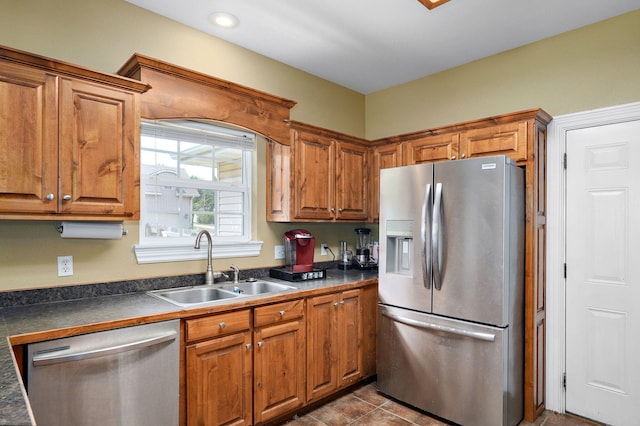 823 Mcvey St, Mount Vernon, MO 65712 - kitchen featuring appliances with stainless steel finishes, dark countertops, and brown cabinets