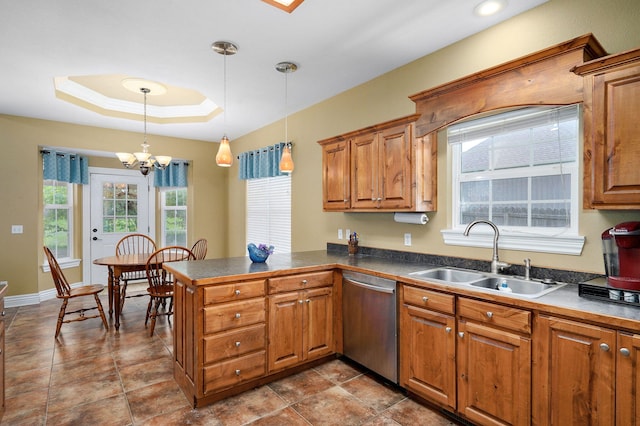 823 Mcvey St, Mount Vernon, MO 65712 - kitchen featuring dishwasher, a peninsula, hanging light fixtures, and brown cabinets