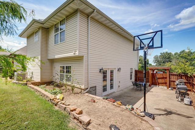 823 Mcvey St, Mount Vernon, MO 65712 - rear view of house with a patio and french doors