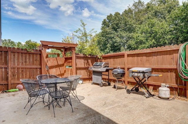 823 Mcvey St, Mount Vernon, MO 65712 - fenced backyard featuring a patio area, a grill, and outdoor dining area