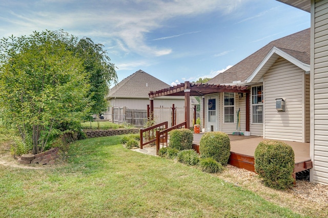 823 Mcvey St, Mount Vernon, MO 65712 - back of house featuring a pergola, roof with shingles, and a deck