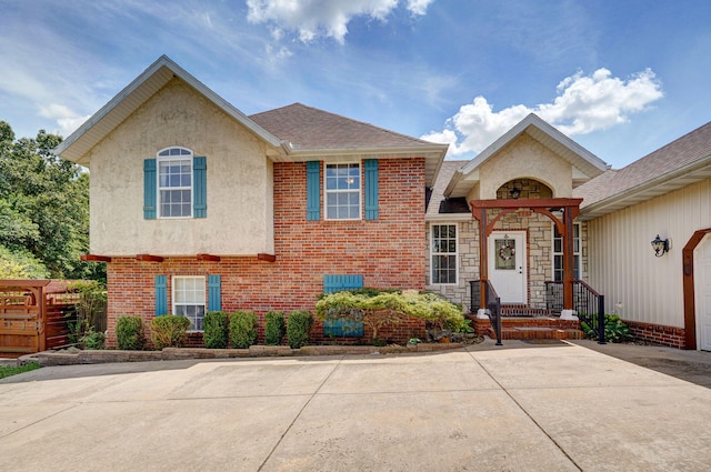 823 Mcvey St, Mount Vernon, MO 65712 - view of front of property with stucco siding and brick siding