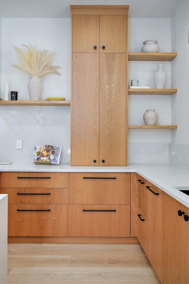 104 Walnut Hill Ln, Ozark, MO 65721 - kitchen with open shelves, light wood-style floors, and light countertops