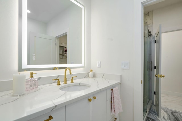 104 Walnut Hill Ln, Ozark, MO 65721 - bathroom featuring vanity, marble finish flooring, and a shower