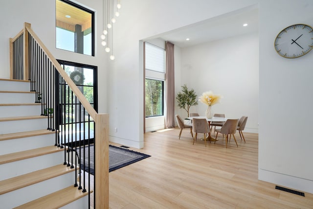 104 Walnut Hill Ln, Ozark, MO 65721 - stairway with wood finished floors and recessed lighting