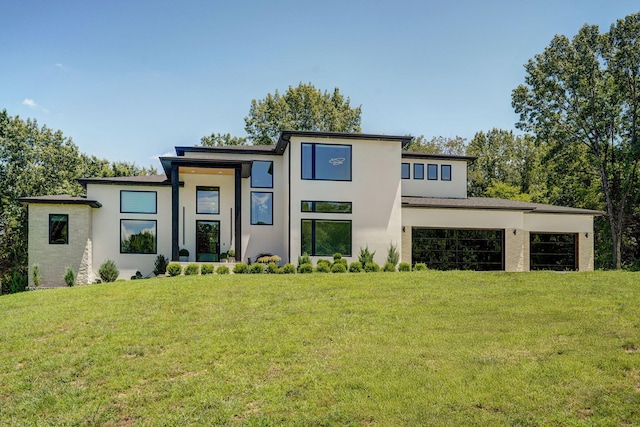 104 Walnut Hill Ln, Ozark, MO 65721 - modern home featuring stucco siding and a front lawn