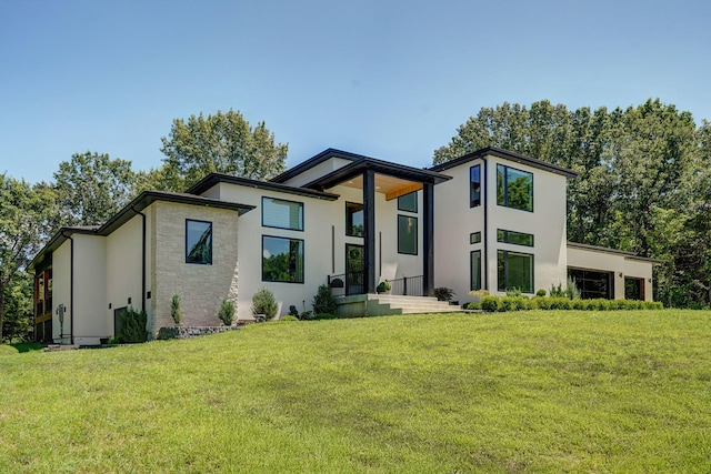 104 Walnut Hill Ln, Ozark, MO 65721 - contemporary house with stucco siding, a front yard, and stone siding