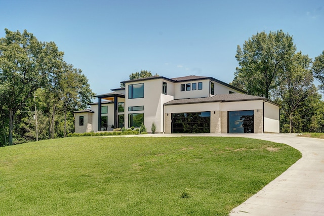 104 Walnut Hill Ln, Ozark, MO 65721 - view of front of property with a front lawn, stucco siding, driveway, and an attached garage