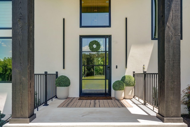 104 Walnut Hill Ln, Ozark, MO 65721 - property entrance featuring stucco siding