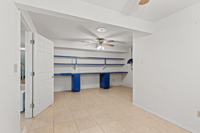 8756 W Farm Rd Unit 124, Springfield, MO 65802 - unfurnished bedroom featuring a textured ceiling and light tile patterned floors