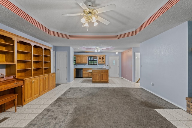 8756 W Farm Rd Unit 124, Springfield, MO 65802 - unfurnished living room with ceiling fan, a textured ceiling, a tray ceiling, light tile patterned flooring, and light colored carpet