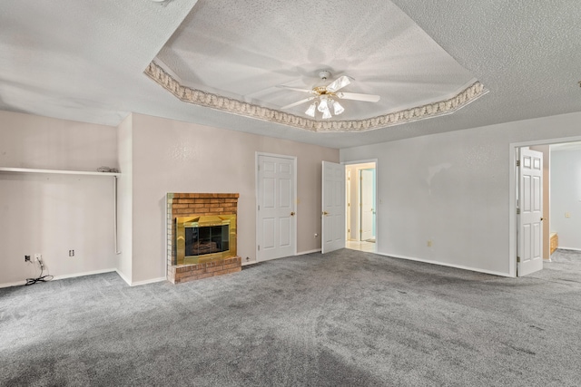 8756 W Farm Rd Unit 124, Springfield, MO 65802 - unfurnished living room with a textured ceiling, a ceiling fan, carpet, and a brick fireplace