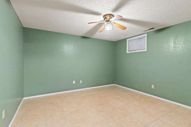 8756 W Farm Rd Unit 124, Springfield, MO 65802 - spare room featuring a ceiling fan, a textured ceiling, and light tile patterned floors