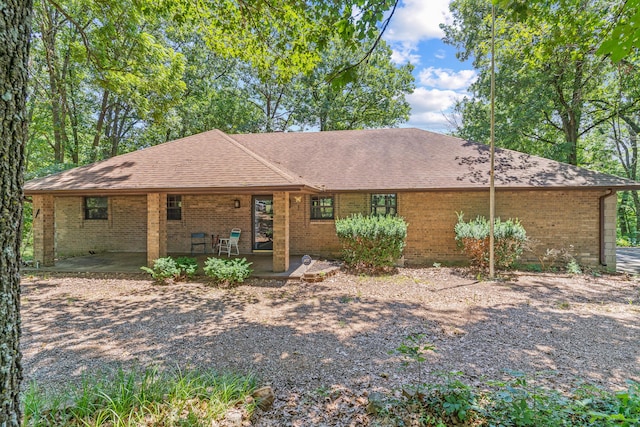 8756 W Farm Rd Unit 124, Springfield, MO 65802 - view of front of home featuring brick siding and roof with shingles