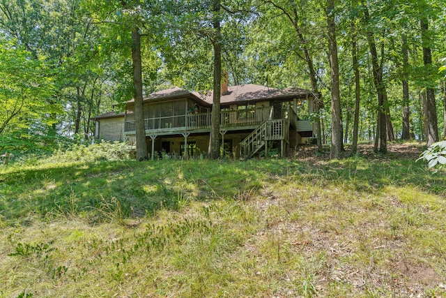 8756 W Farm Rd Unit 124, Springfield, MO 65802 - back of house featuring stairs, a wooden deck, and a sunroom