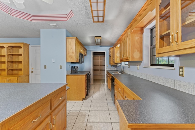 8756 W Farm Rd Unit 124, Springfield, MO 65802 - kitchen with electric stove, black microwave, a textured ceiling, dark countertops, and light tile patterned floors