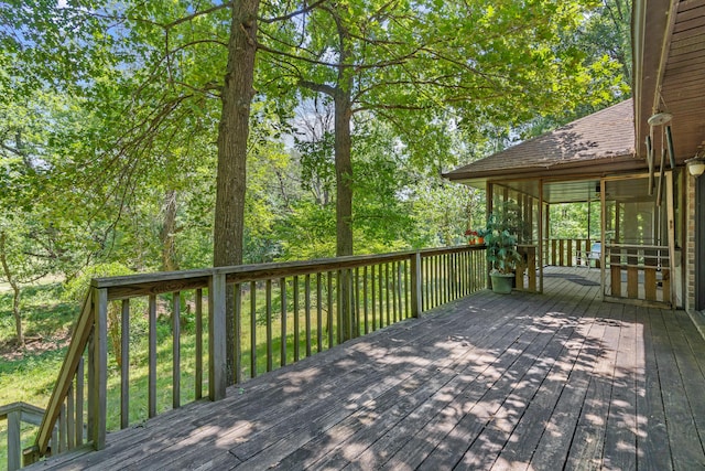 8756 W Farm Rd Unit 124, Springfield, MO 65802 - wooden deck with a sunroom