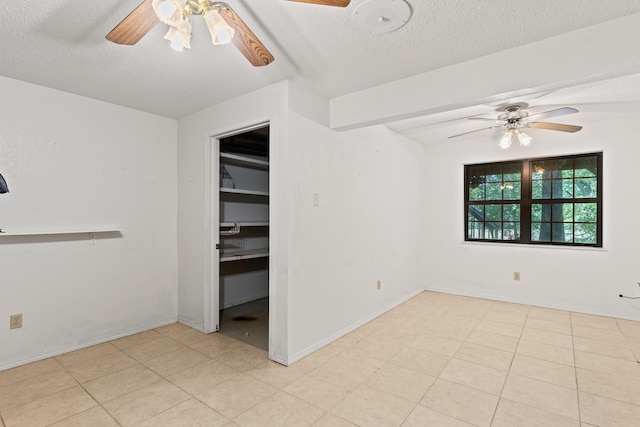 8756 W Farm Rd Unit 124, Springfield, MO 65802 - unfurnished room with ceiling fan and a textured ceiling