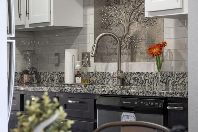 2915 Vineyards Pkwy Unit 6, Branson, MO 65616 - kitchen with dishwasher, backsplash, and white cabinetry