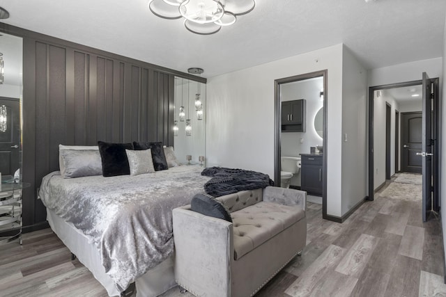2915 Vineyards Pkwy Unit 6, Branson, MO 65616 - bedroom featuring light wood-style flooring and ensuite bathroom