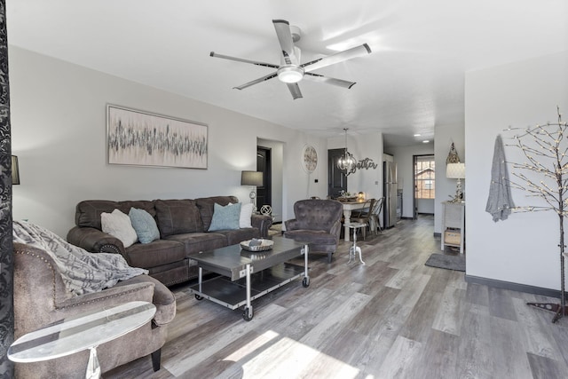 2915 Vineyards Pkwy Unit 6, Branson, MO 65616 - living area featuring wood finished floors, ceiling fan, and a chandelier