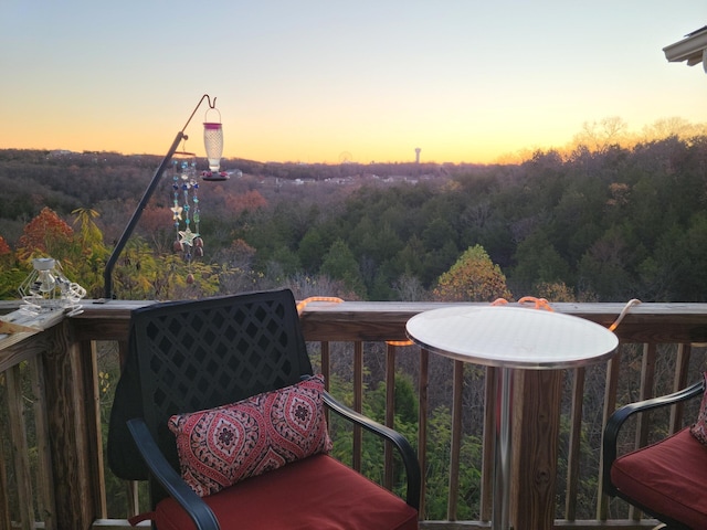 2915 Vineyards Pkwy Unit 6, Branson, MO 65616 - balcony at dusk with a view of trees