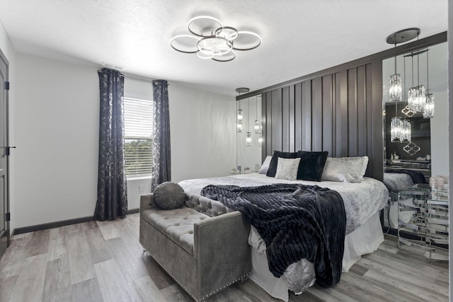 2915 Vineyards Pkwy Unit 6, Branson, MO 65616 - bedroom featuring a chandelier and light wood finished floors