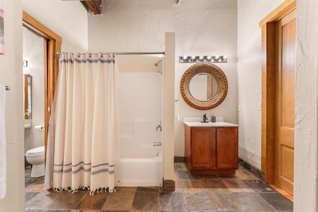 509 W Olive St Unit 206, Springfield, MO 65806 - bathroom featuring stone tile flooring, shower / bath combo, and vanity