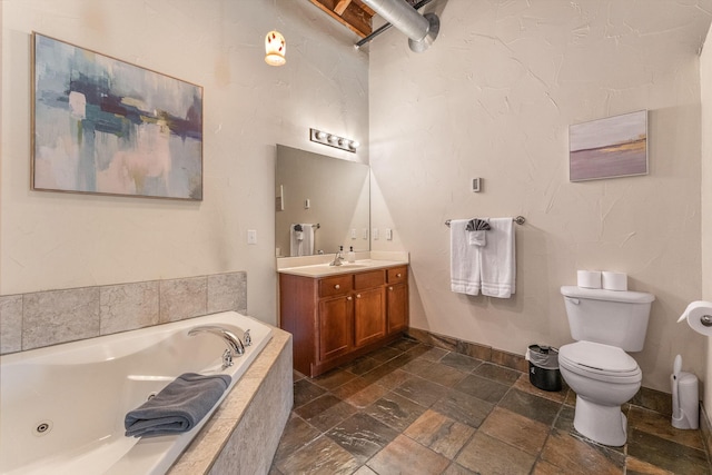 509 W Olive St Unit 206, Springfield, MO 65806 - full bathroom featuring vanity, a jetted tub, and stone tile flooring