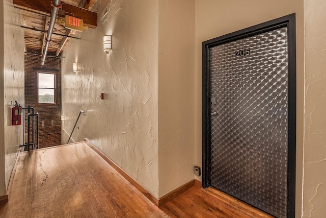 509 W Olive St Unit 206, Springfield, MO 65806 - corridor with wood finished floors and an upstairs landing