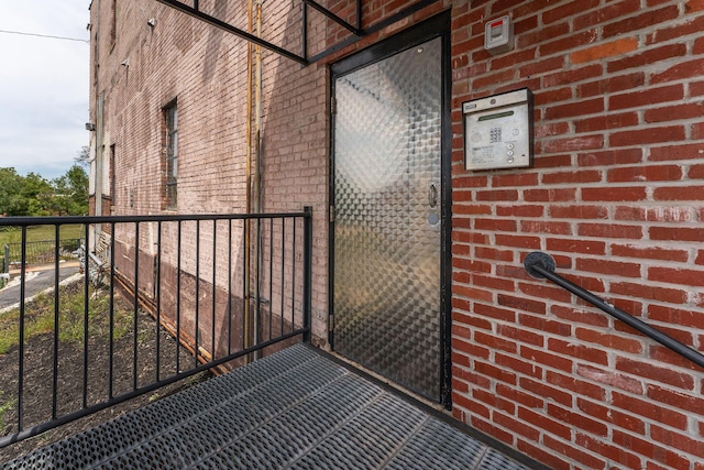 509 W Olive St Unit 206, Springfield, MO 65806 - doorway to property featuring brick siding