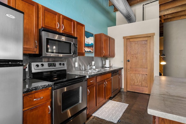 509 W Olive St Unit 206, Springfield, MO 65806 - kitchen with appliances with stainless steel finishes and brown cabinetry