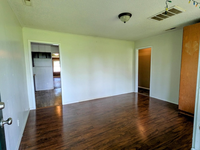13802 E State Highway 76, Taneyville, MO 65759 - empty room with wood finished floors and a textured ceiling