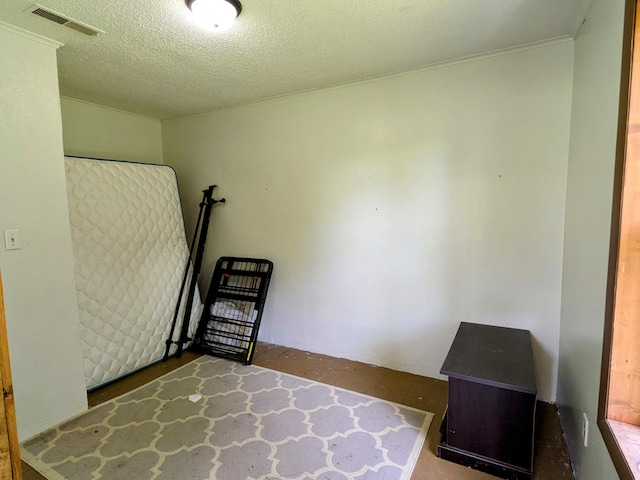 13802 E State Highway 76, Taneyville, MO 65759 - unfurnished bedroom featuring a textured ceiling and crown molding