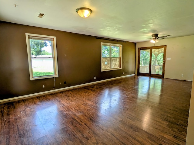 13802 E State Highway 76, Taneyville, MO 65759 - empty room with wood finished floors and a ceiling fan
