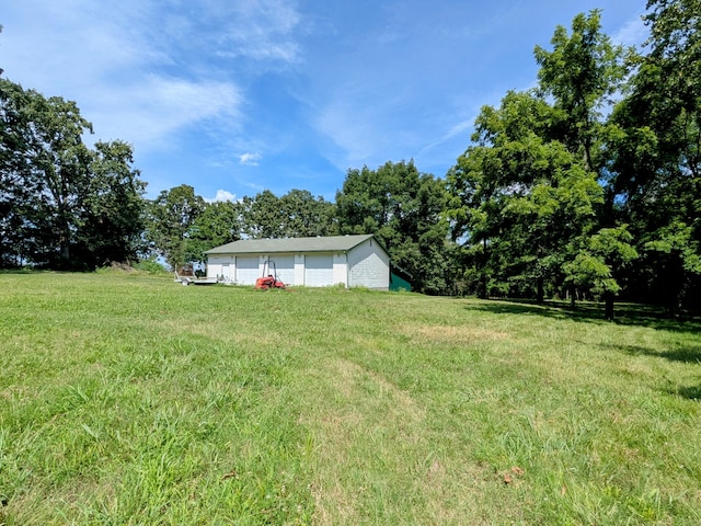 13802 E State Highway 76, Taneyville, MO 65759 - view of grassy yard with a detached garage