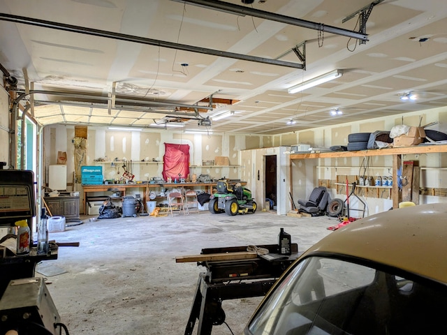 13802 E State Highway 76, Taneyville, MO 65759 - garage with a workshop area and a garage door opener