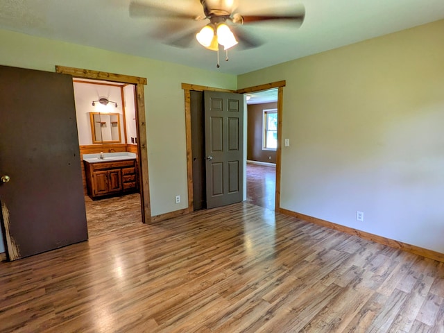 13802 E State Highway 76, Taneyville, MO 65759 - spare room featuring wood finished floors and a ceiling fan